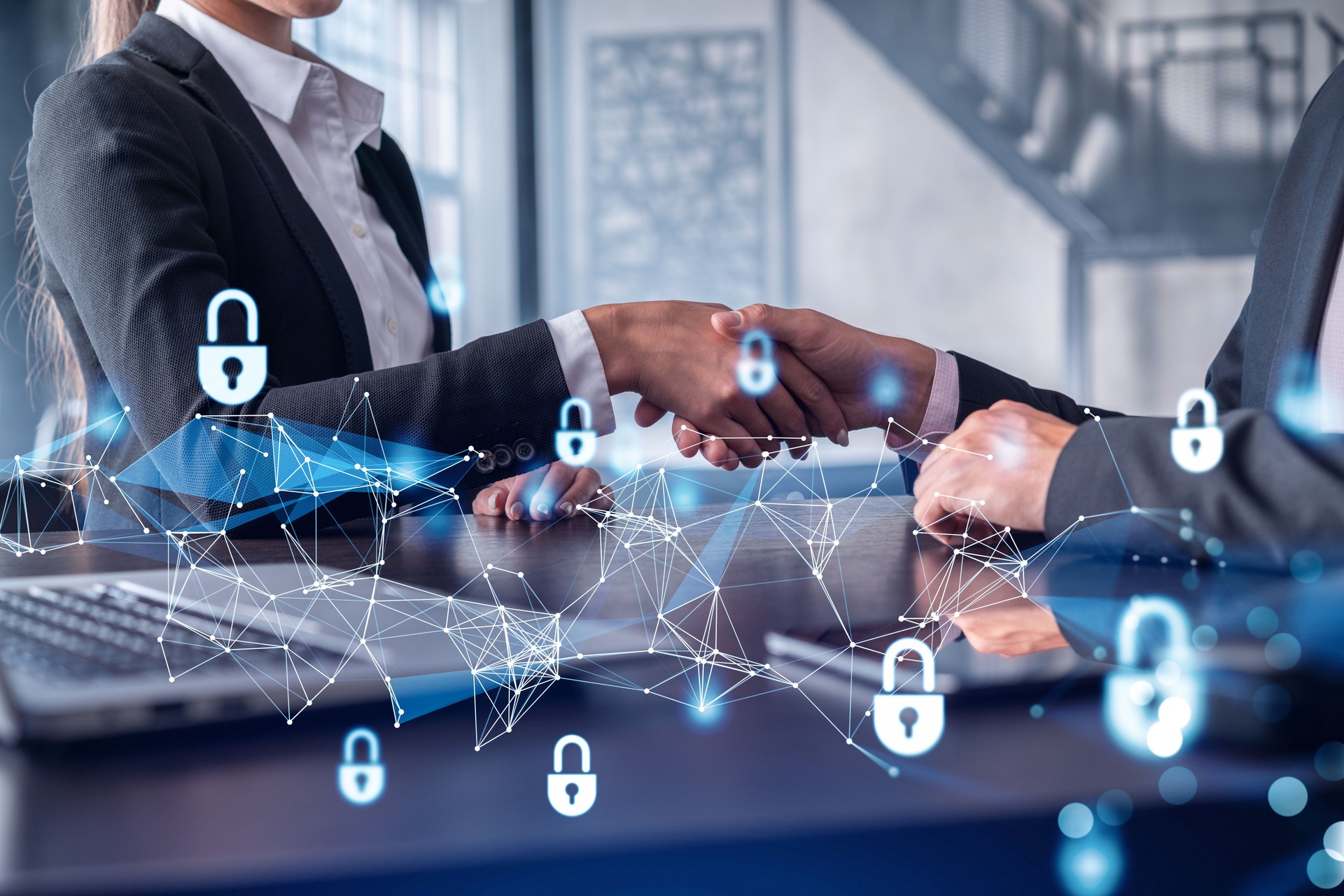 Handshake of two businesspeople who are negotiated the project to protect cyber security of international company. Padlock Hologram icons. Woman in business.